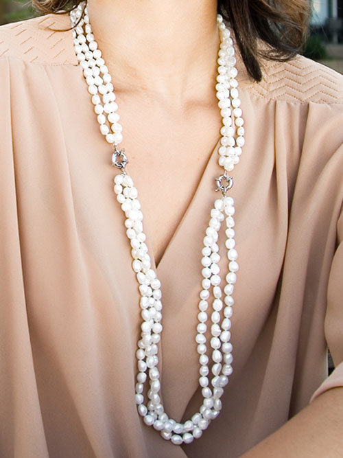 Alma & Co. Elsa necklace. Three strands of genuine white freshwater pearls with a slide lock clasp in silver necklace